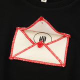 Black Ruffle Sweatshirt With Envelope Applique Detail