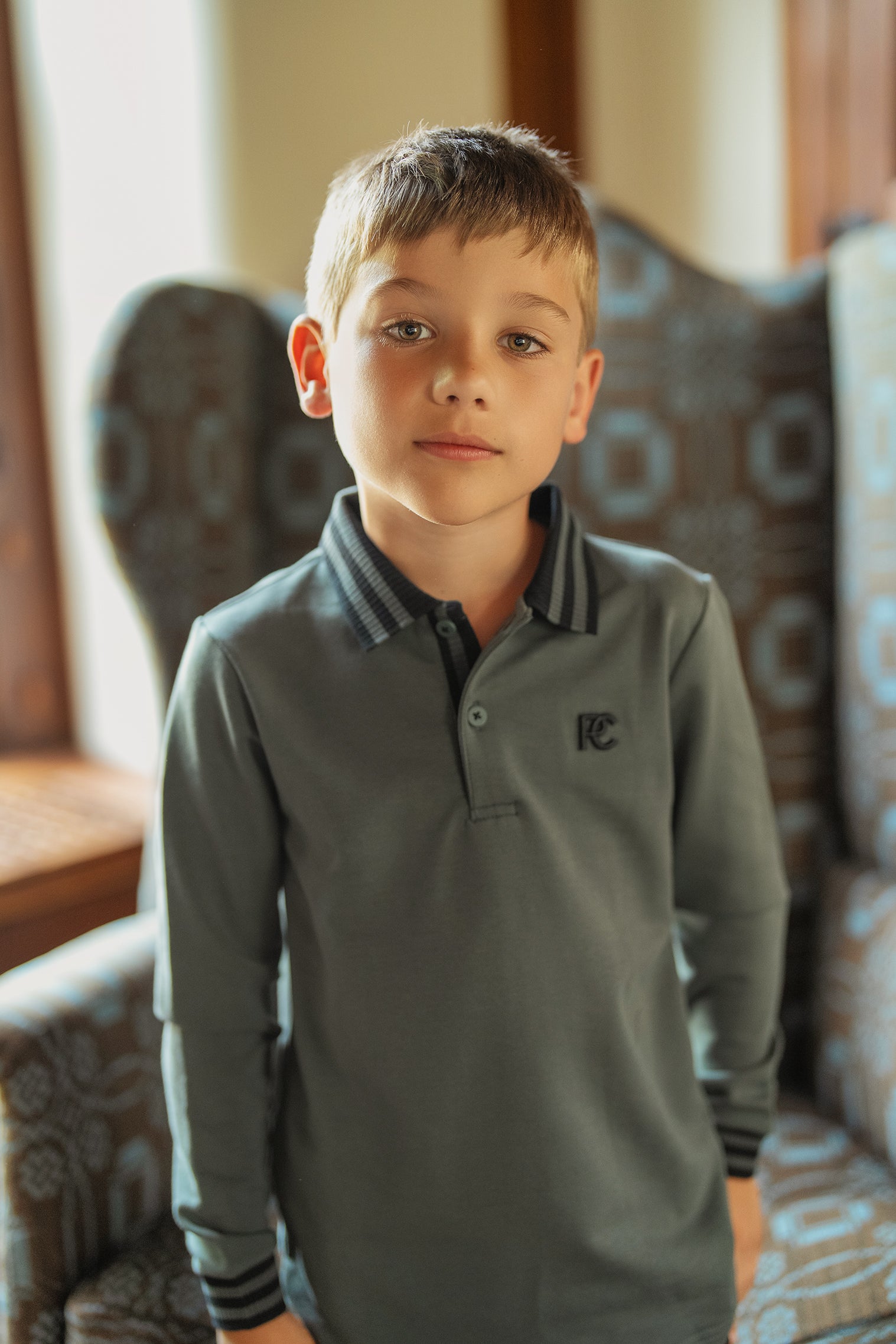 Boys Green Polo with Black Striped Trim